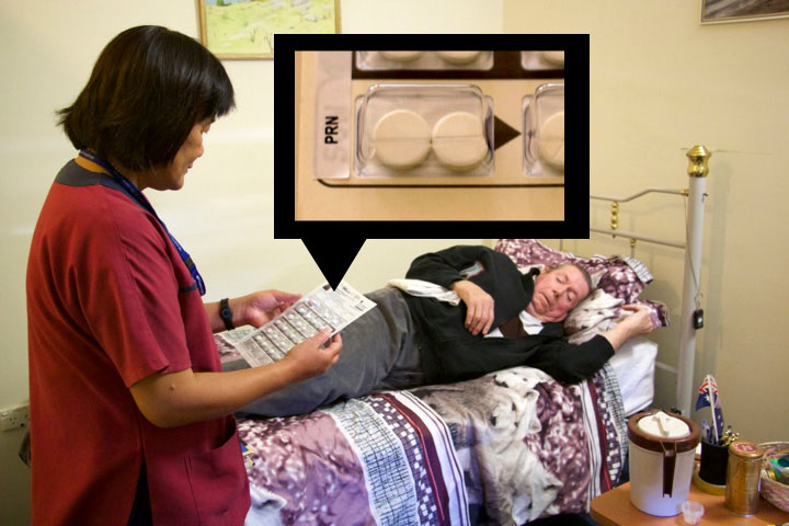 Jamie taking two tablets from the pack